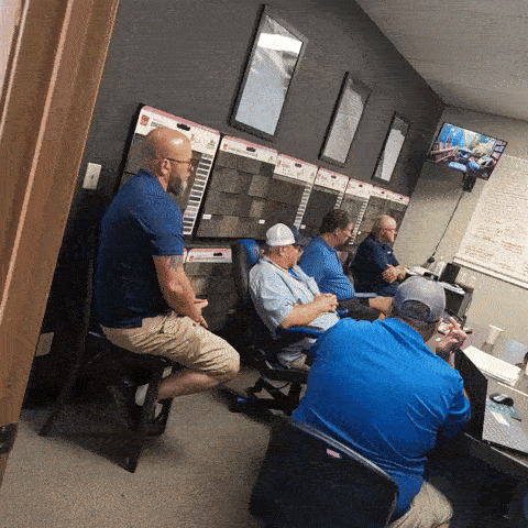 Several members of Team Ridgeline sitting in the conference room at Ridgeline Roofing and Solar's home office in Joplin, MO.