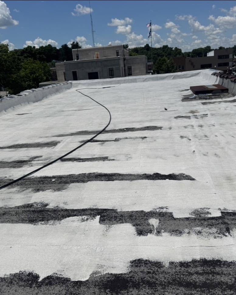 A before look at a commercial roof in Neosho right before adding Polyglass Silicone